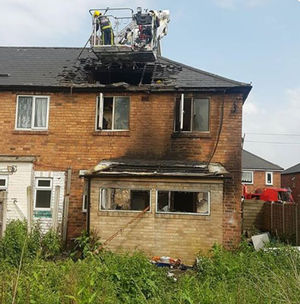 The crew were suspended above the house for two hours. Picture: Andrew Birch