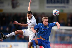 Russell Benjamin of AFC Telford United and Iain Howard of Stockport County