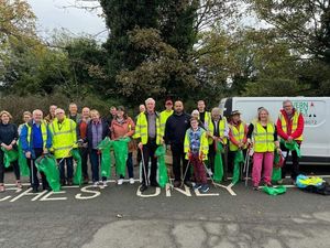 Supporting image for story: Volunteers muck in to clear up streets ahead of town's annual 10K