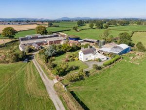 Supporting image for story: 162-acre former dairy farm near Shrewsbury with 'beautifully preserved' farmhouse and stunning views listed for sale