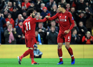 Liverpool's Mohamed Salah (left) celebrates 