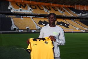 Mateus Mane signs his first professional contract with Wolves, aged 17 (Picture: Wolves)