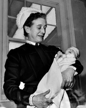 Matron Irene Braithwaite with a newborn baby in 1962.