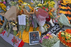Scarves, cards and flowers were placed outside Molineux