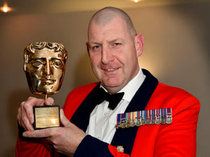 Supporting image for story: Shropshire's hero of the Queen's funeral comes home for Rotary club dinner