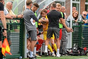 Quorn boss Richard Lavery clashes with Bucks midfielder James McQuilkin