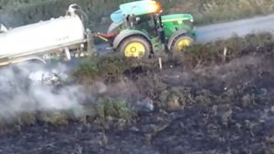 Farmers using water bowsers to put out the fire