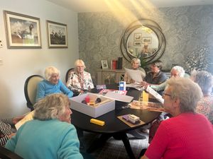 Residents at HC-One’s Priorslee House Care Home opening the Boots memory boxes