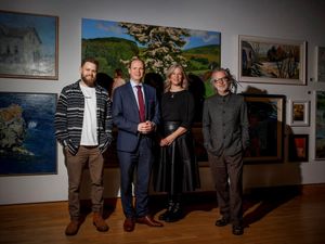 Songwriter Chris Bateman, Communities Minister Gordon Lyons, harpist Anne Harper and composer Peter Wilson (Duke Special) stand in front of paintings