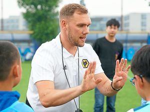 Supporting image for story: Wolves coach lends his expertise in China