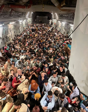 Afghan citizens pack inside a US plane to get out of the country

