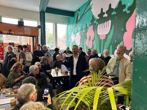 Zack Polanski addressing Green Party members at the event at Shrewsbury Market Hall.