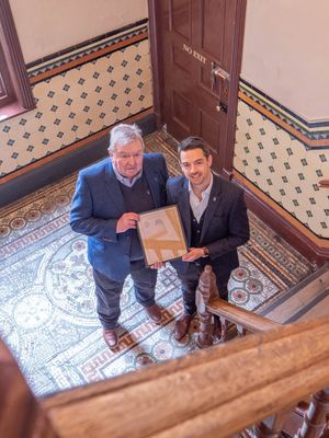 Simon Howells, the current Managing Directors of Craven Dunnill & Co, with dad Peter, holding is the original Certificate of Incorporation from 9th February 1872. 