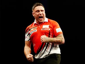 Gerwyn Price celebrates during his match against Rob Cross on night seven of the BetMGM Premier League at Utilita Arena, Cardiff