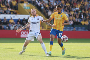 Carl Winchester and Mansfield Town's Keanu Baccus (AMA)