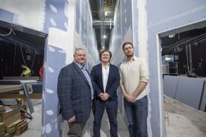 Councillor Stephen Simkins, James Jervis of PDJ, and Councillor Chris Burden stand between screens 1 and 2 of the new Lockworks Cinema
