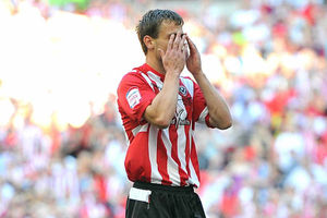 Andy Taylor reacts after missing from the penalty spot for Sheffield United.