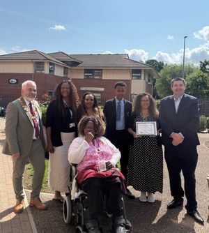 Shaun Davies MP with Joyce alongside her family and Mayor of Lawley, Councillor Mark Boylan