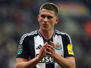 Newcastle’s Sven Botman applauds the fans as he is substituted against Arsenal
