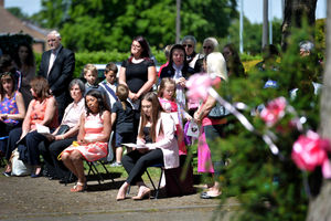Mourners gathered outside the church 