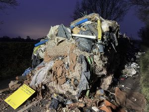 Supporting image for story: Man and business charged over 27-tonne mound of waste that blocked road