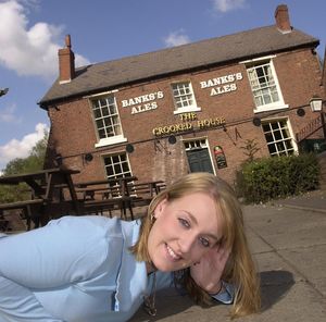 Barmaid Gemma Clark is ready for tremors at the Crooked House - 500m from the epicentre of the earthquake