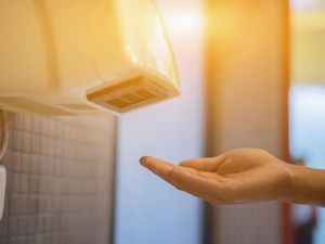 Supporting image for story: Bathroom hand dryers may be blowing bacteria and faeces all over you, study suggests
