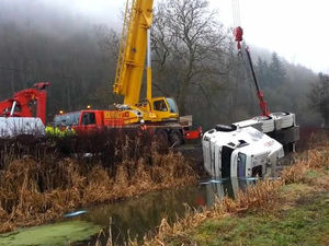 Supporting image for story: Watch: Crane lifts crashed lorry from canal