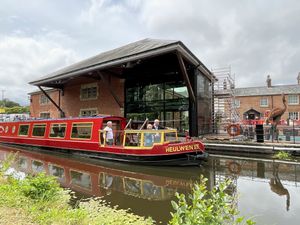 Dame Nia Griffith viewing the improvements to Y Lanfa in Welshpool from the Heulwen Trust canal boat.