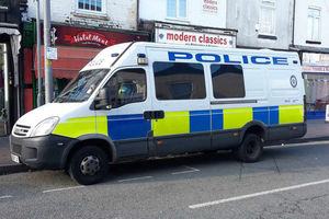 A police van parked on Shireland Road opposite Hi-Tech Music