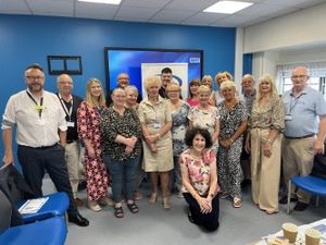 A group photo of Cannock volunteers, NHS management and League of Friends Staff
