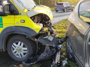 Supporting image for story: Ambulance taking patient to hospital collides with car at busy crossroads