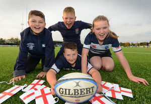 Rugby fans Ethan Bird (top), Ethan Smith (left), Alfie Darby, all age 11, and Phillipa Harlow, 12, ahead of the game at Stourbridge Rugby Club