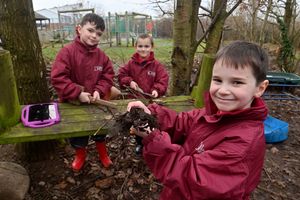 Alfie Bennett, Callum Green, and Declan Wyke, learning in Wilfred Owen Primary School's 'forest school'. Picture: Steve Leath