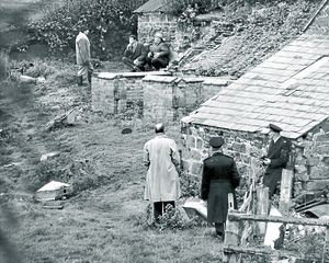 Police played a waiting game, surrounding the siege house. Superintendent Bob Landers is top, squatting and wearing a cap. Top left standing is Barrie Florentine, who was an assistant chief constable and had not been in the post for long