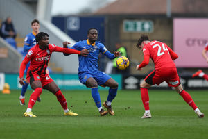 Dan Udoh of Shrewsbury Town and Babajide Adeeko of Wigan Athletic (AMA)