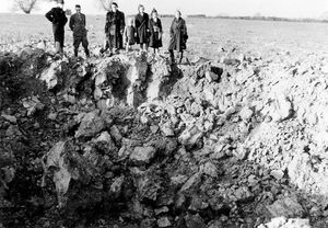 This huge bomb crater was at Rowton Farm, near Broseley, in November 1940. Daisy, Roger, and Sylvia were among those who peered from the edge.