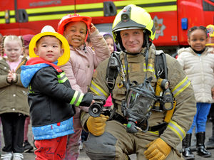 Supporting image for story: Plenty of fun on the fire engine for city youngsters in firefighter visit