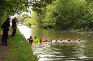 Police searching the canal