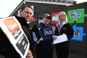 Sarah Turbutt, whose 14-month-old son attends the nursery, signs a petition
