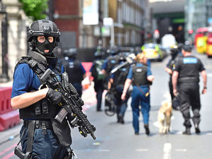 Armed police on St Thomas Street, London, near the scene of the terrorist incident at London Bridge