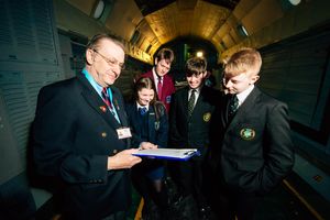 Tour guide Paul Lloyd shows pupils around RAF Cosford