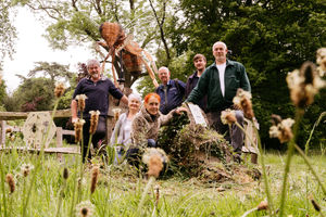 The Giant Bee Sculpture at The Mere in Ellesmere has been given a spruce up. From left are: Shaun Burkey, Wendy Salter, Caroline Lowe (the original artist), Hywel Edwards, Lee Fraser and Paul Churchus