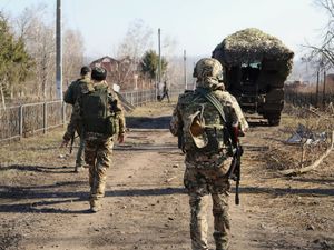 Russian soldiers patrol an area in the Kursk region