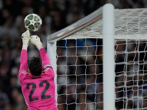 David Raya pushes the ball over the bar