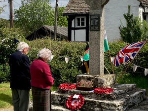 Dave Latham, who read the names from the War Memorial and Joan Hughes, who laid a wreath on behalf of Gladestry WI