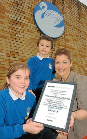 With the award are pupils Katy Bambridge,10, Callum Austin, seven and Mrs Sharon Munro, deputy head and gifted and talented co-ordinator