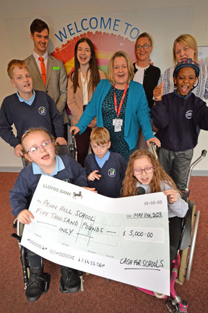 Penn Hall School came first in our Cash for Schools competition, winning £5,000. Pictured is headteacher Sarah Wilkinson with students and sponsors.