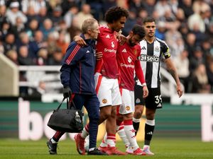 Manchester United’s Joshua Zirkzee (second left) is helped from the pitch after picking up an injury