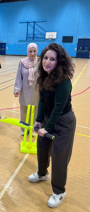 Cllr Adeela Qayyum (behind the wickets), Dr Samara Afzal (batting)